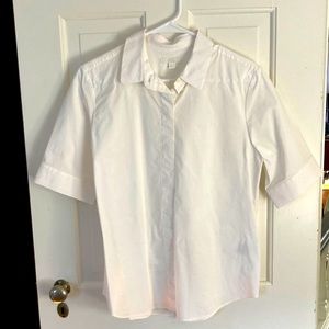 COS white button front shirt with half sleeve and abbreviated length.